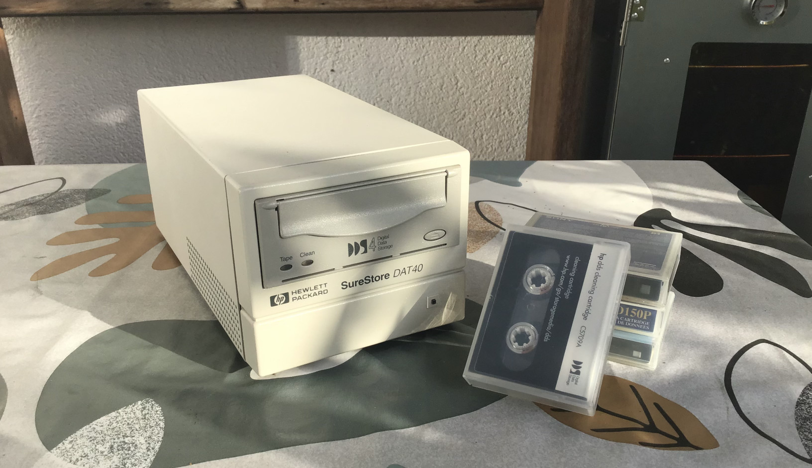 A Surestore DAT40 Tape Drive standing on a table